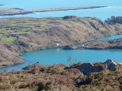 Scenic coastal landscape with blue water and hills