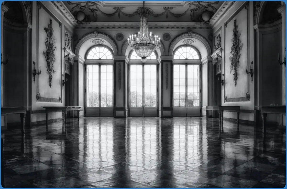Elegant ballroom with chandeliers and large windows