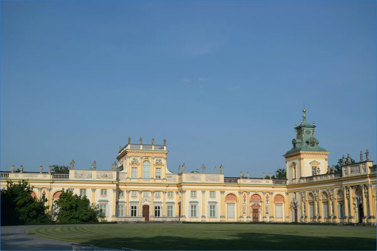 Yellow palace with decorative architecture.