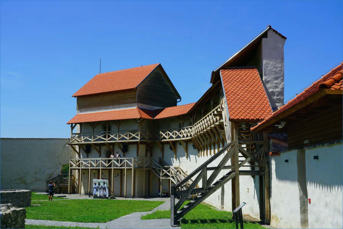 Historic building with wooden structures and red roofs