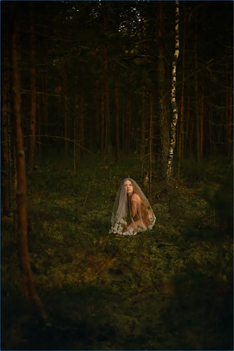 Person in a forest wearing a veil