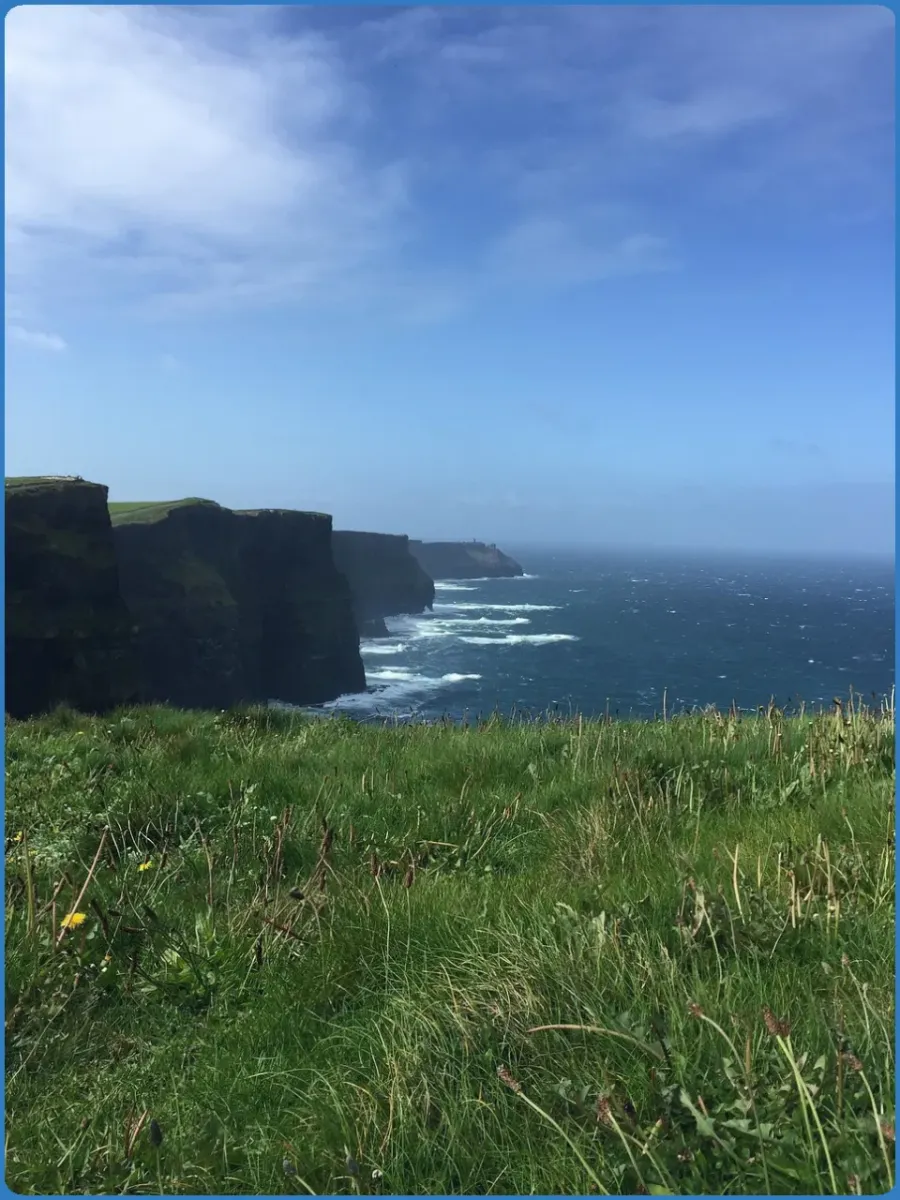 Cliffs and ocean under a blue sky