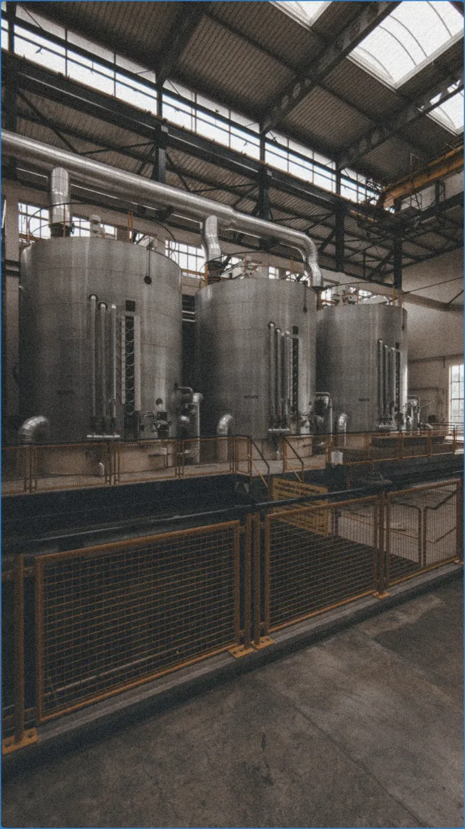 Industrial tanks in a factory setting