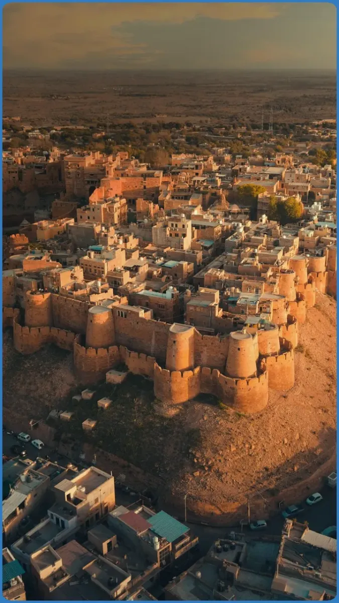 Aerial view of an ancient fort with surrounding buildings.