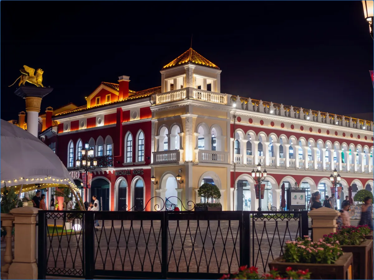 Illuminated building with arches at night