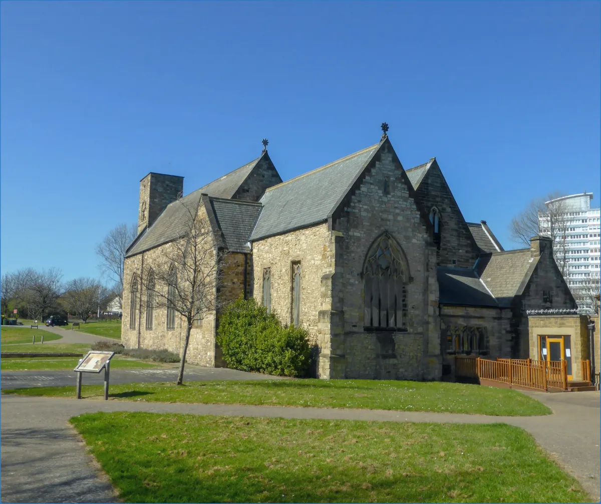 Stone church building with a clear blue sky