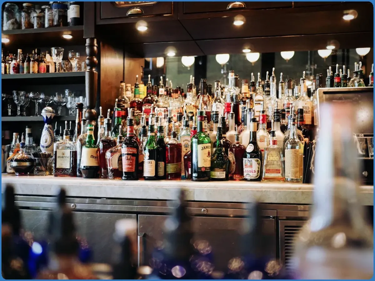 Bar counter with various liquor bottles