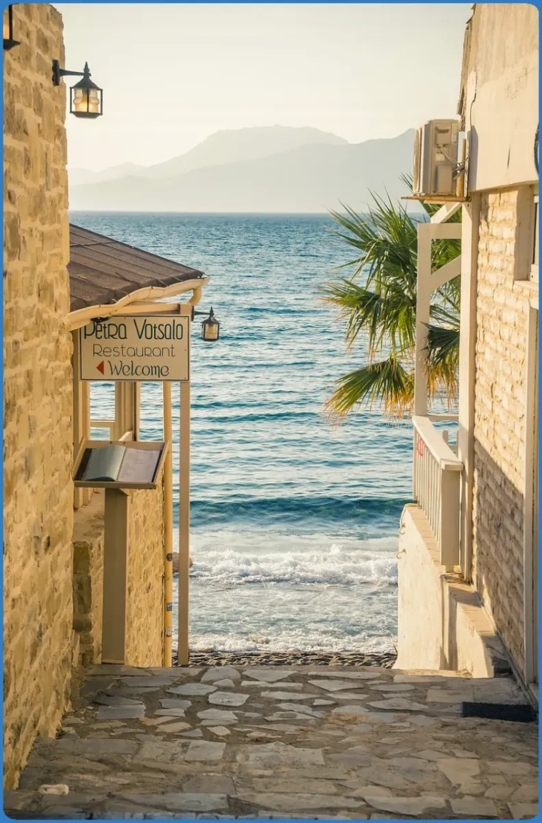 Stone alley leading to a seaside view
