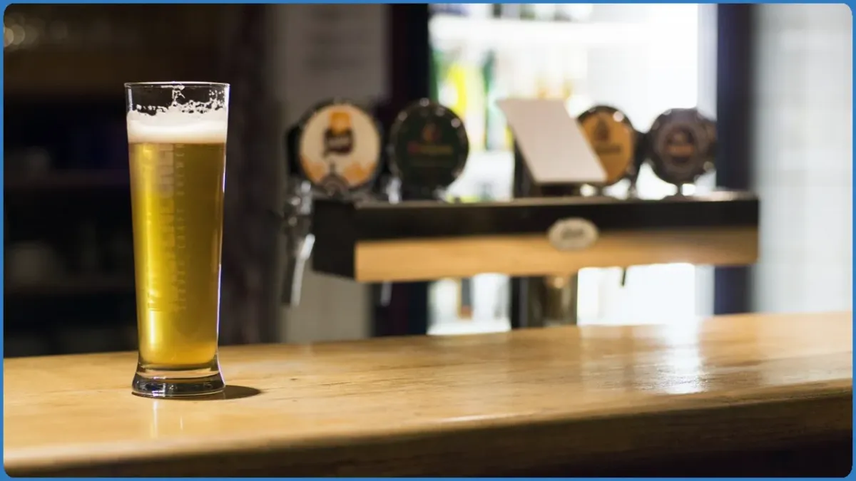 Glass of beer on a bar counter