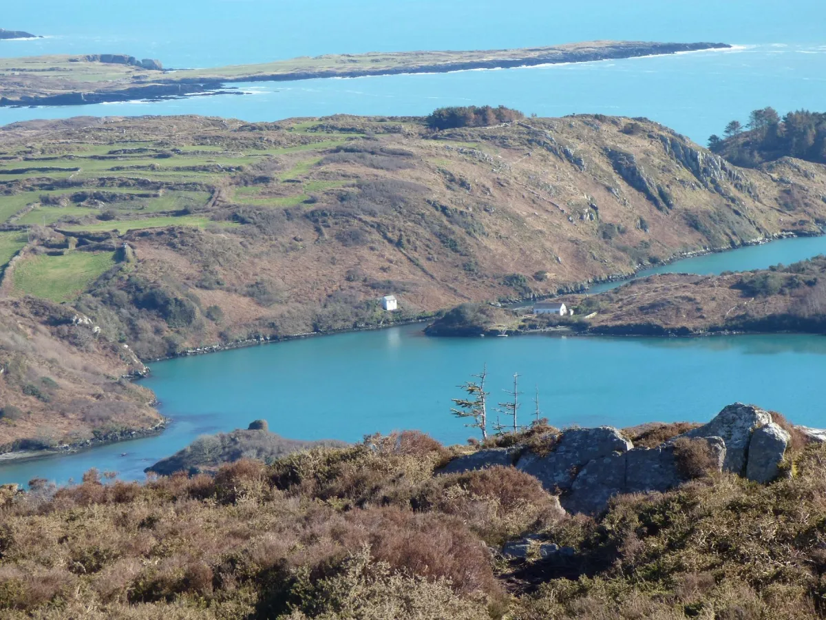 Scenic coastal landscape with blue water and hills
