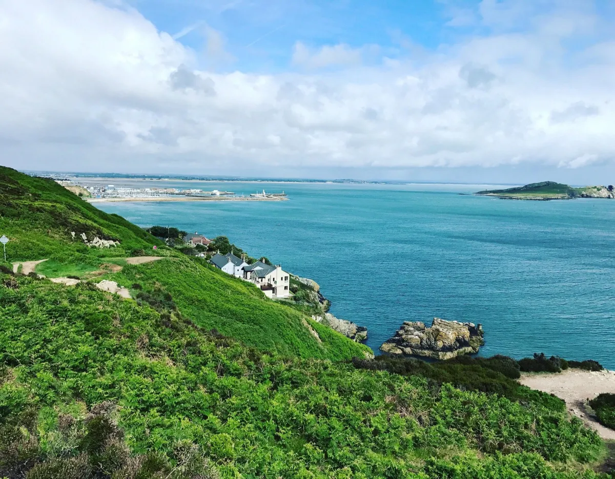 Coastal landscape with green hills and blue sea