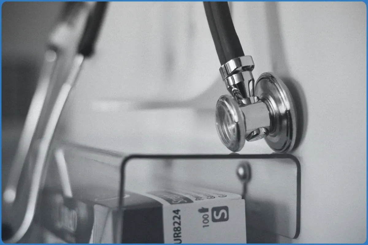 Close-up of a stethoscope hanging on a wall.
