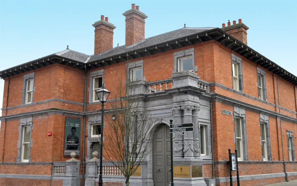 Historic red brick building with ornate entrance