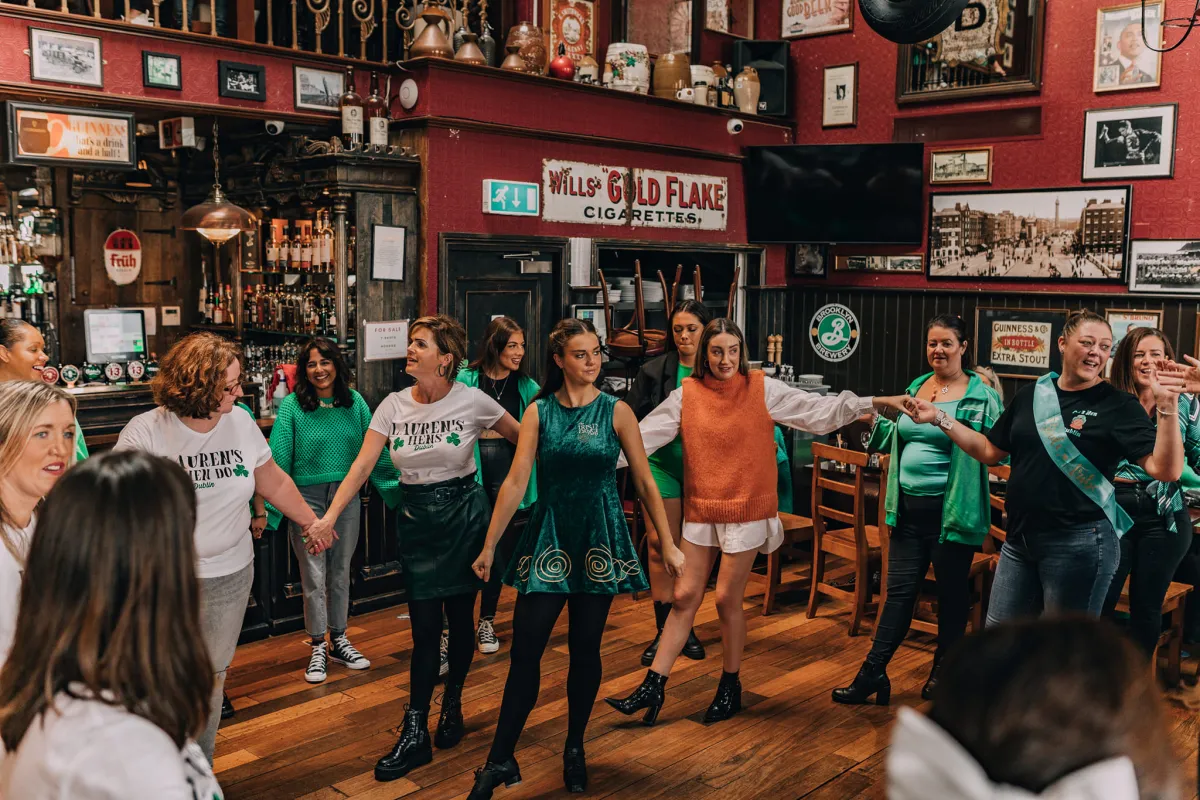 Group of people dancing in a pub