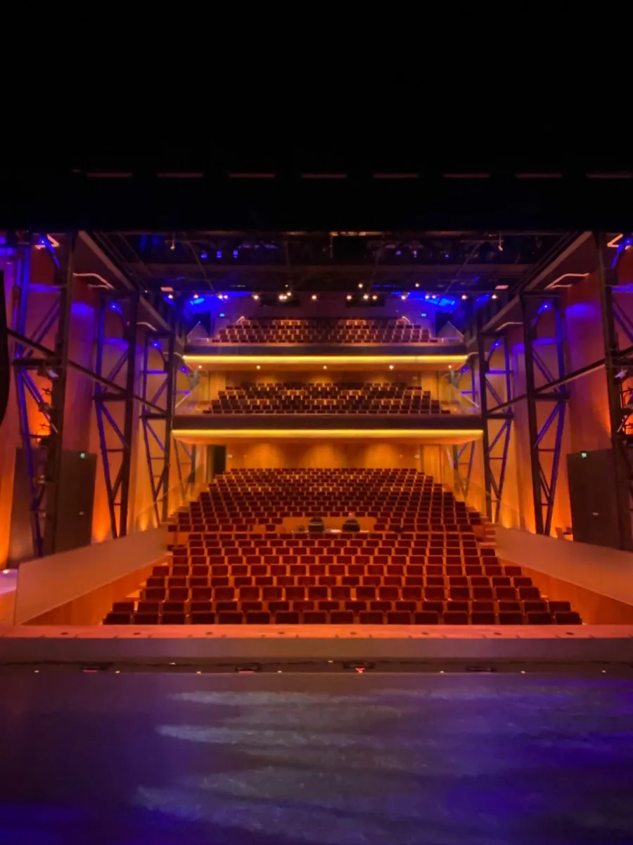 Empty theater auditorium with rows of seats