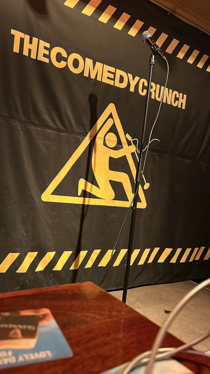 Comedy stage with microphone and backdrop