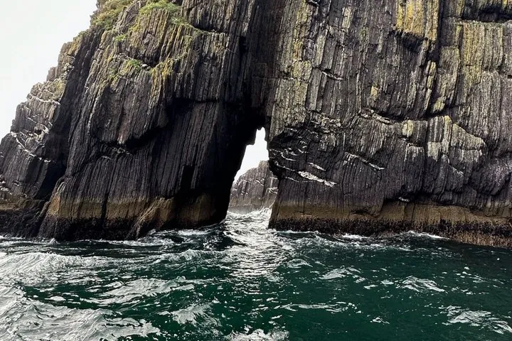 Rock formation with a natural arch over the sea