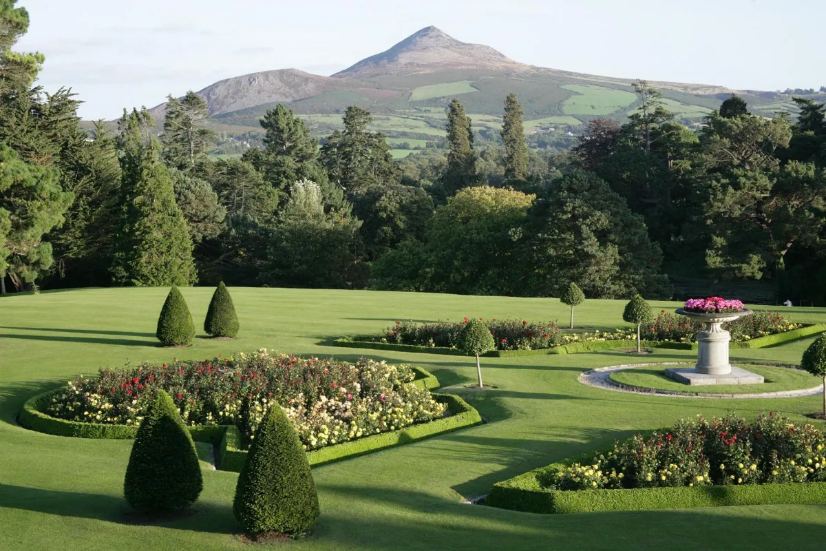 Manicured garden with flower beds and mountain view
