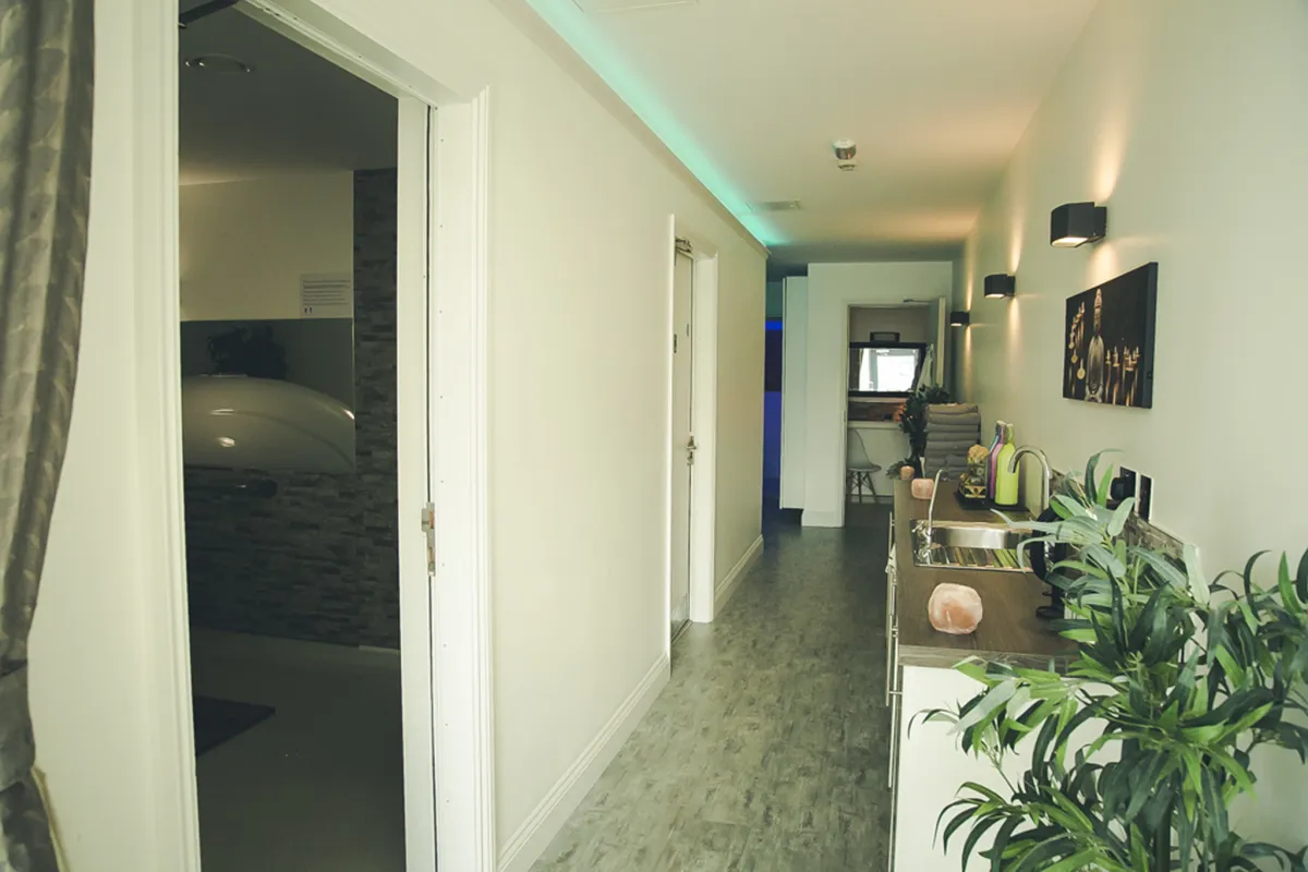 Modern spa hallway with plants and decor