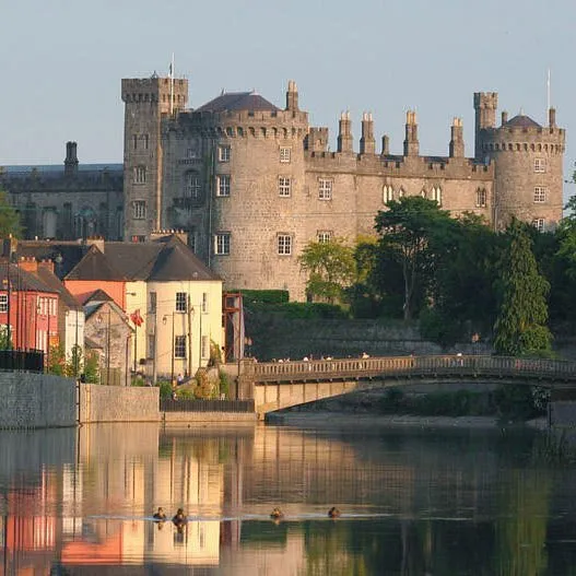 Castle and colorful buildings by a river