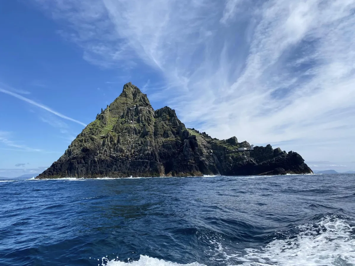 Skellig Michael island rock rising from the Atlantic ocean during a boat tour