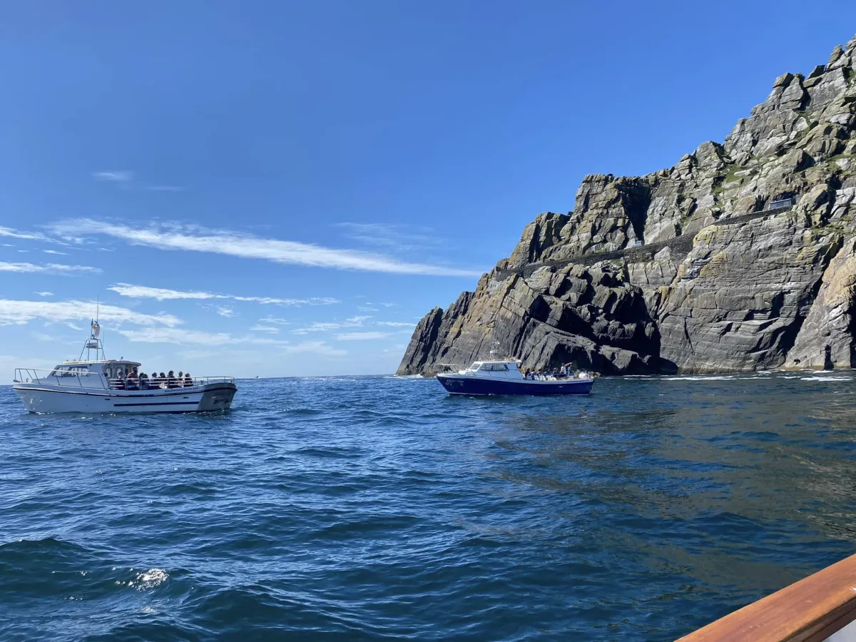 Visitors on Skellig Michael cruises exploring the rocky coastline and cliffs