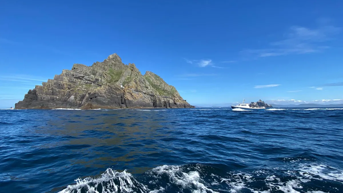 Boat cruising towards Skellig Michael and Little Skellig islands in Ireland