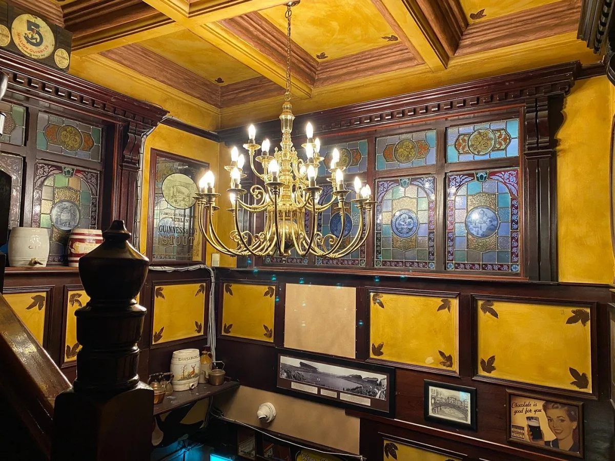 Interior with chandelier and stained glass windows.