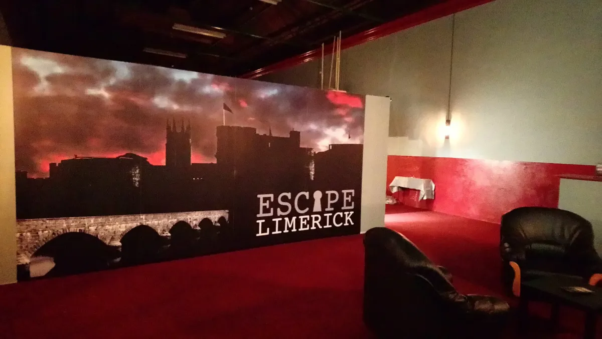 Escape Limerick room with dark decor and seating area.
