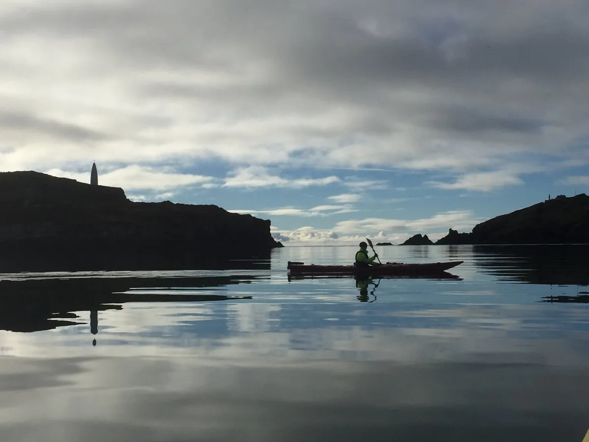 Atlantic Sea Kayaking — recreation base in Cork, kayaker on calm sea