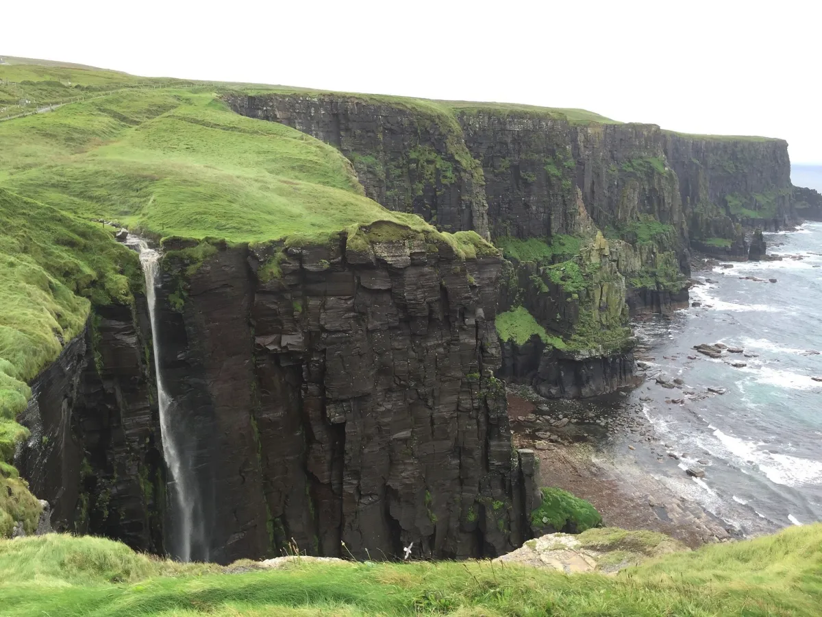 Cliffs with a waterfall and ocean view