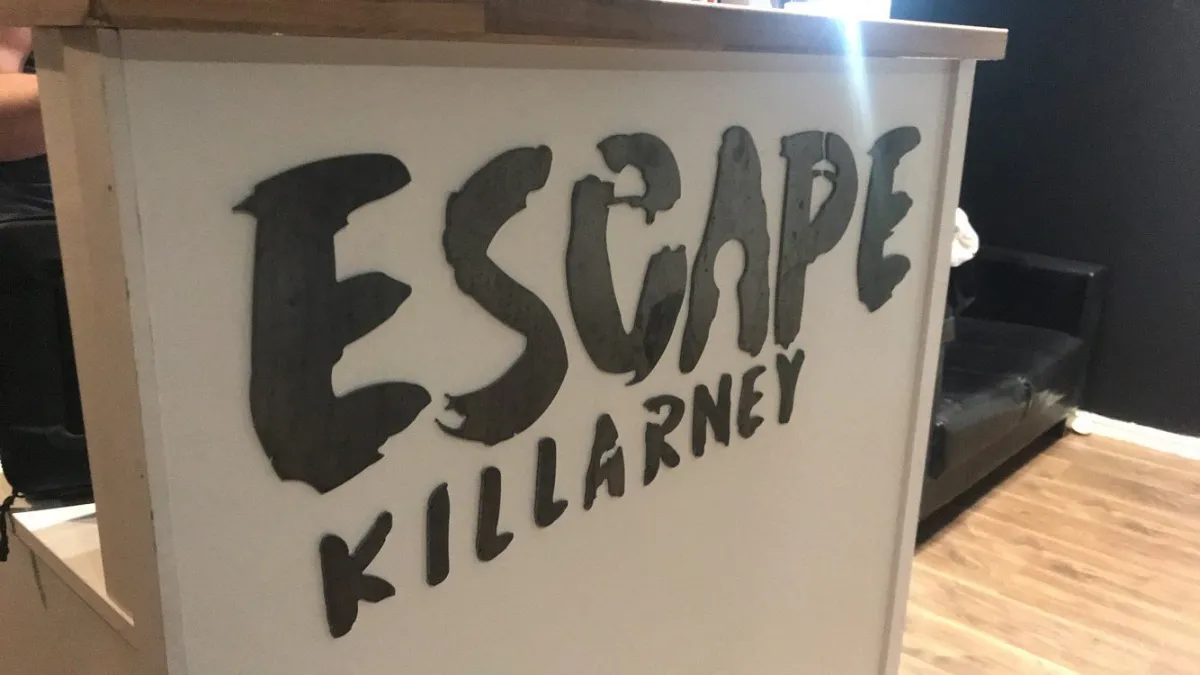 Reception desk with Escape Killarney sign