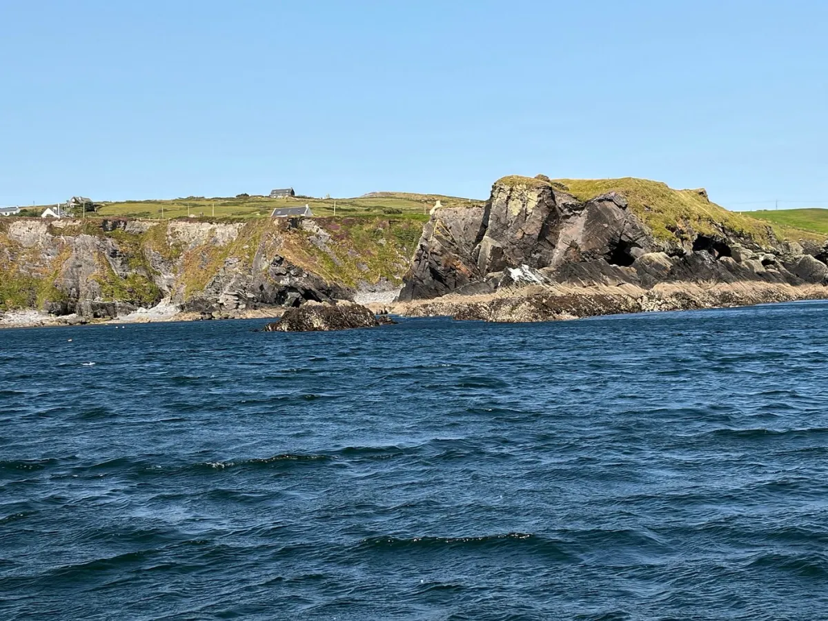 Rocky coastline with blue sea and clear sky