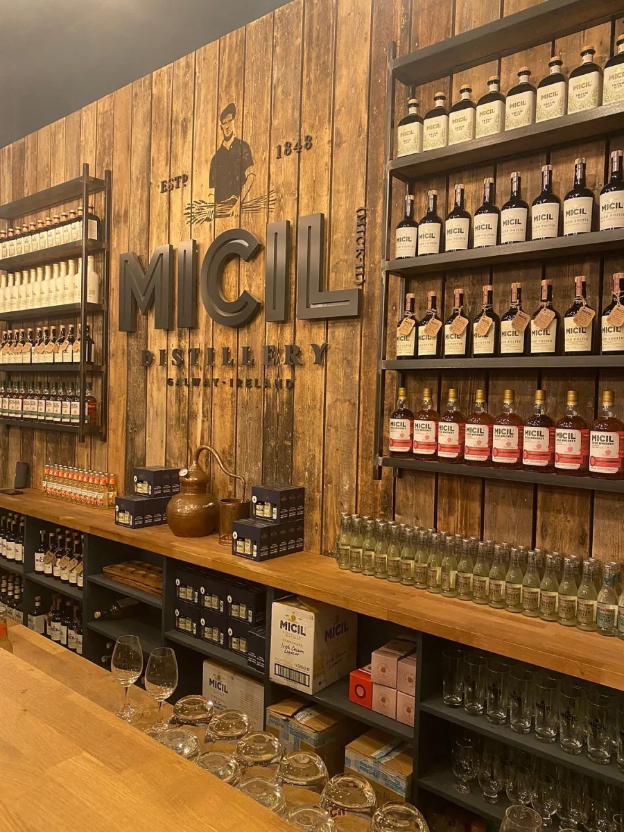 Micil Distillery — recreation place in Gaillimh, wooden shelves with spirits