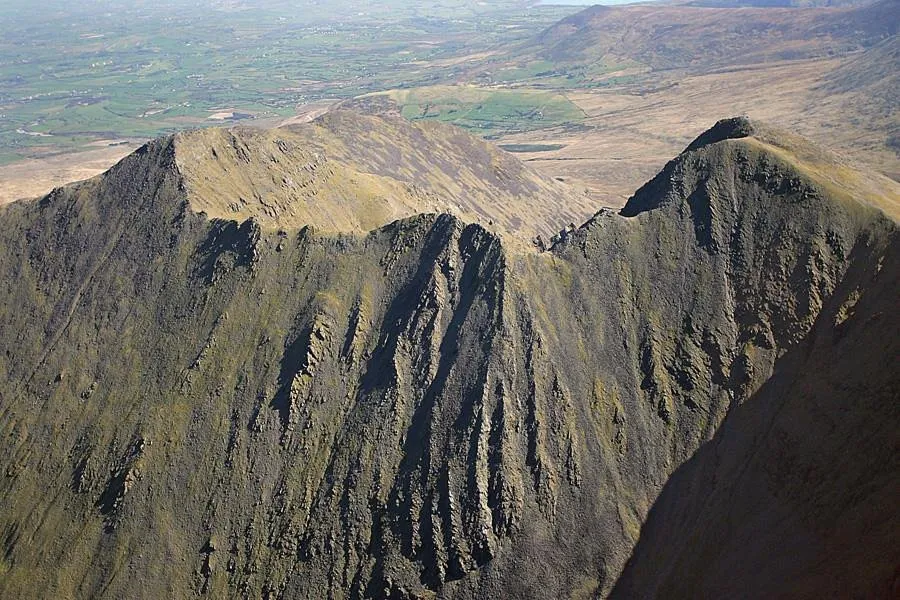 Aerial view of rugged mountain peaks.