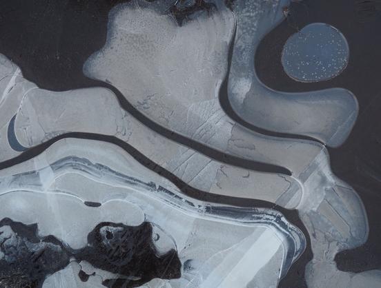 More patterns in a frozen puddle.
