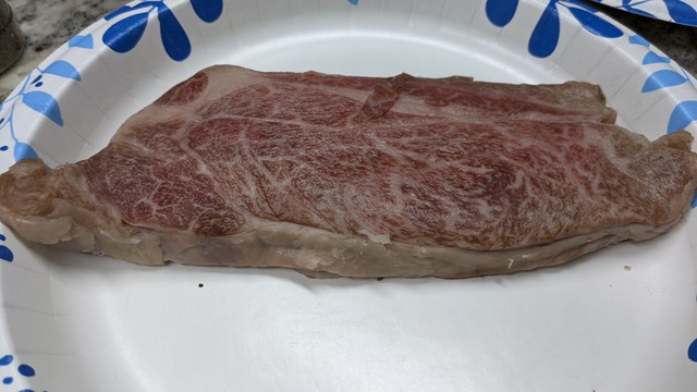 A5 Wagyu steak looks good, but something has to be off, that's because it was frozen then thawed in the mail to me, then frozen again aka, this is dog food. Spoiler always in the alt text.