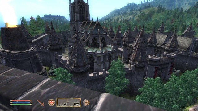 The city of Skingrad sprawls below in the midst of a wide, forested valley. A temple stands in the middle of multiple upper-class houses.