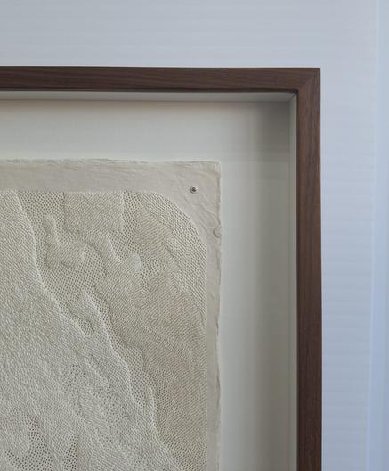 Pin prick artwork in a frame. Photo shows top right corner.