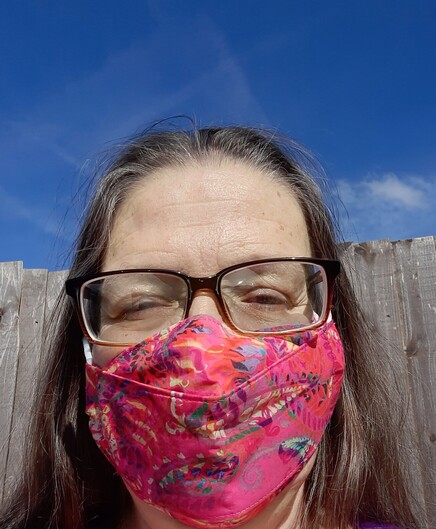 Me, wearing a colourful mask, on a much sunnier day than today.