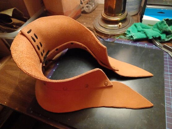A view of the top of a leather neck guard, showing the contours.