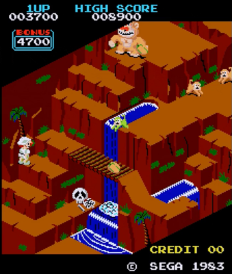 A gameplay gif from "Congo Bongo", which has an isometric perspective. Player one (a man dressed as an explorer) navigates a series of cliffs while a giant gorilla tosses coconuts at him.