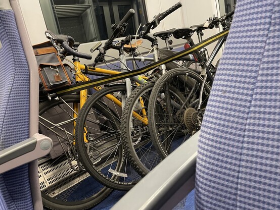 4 bikes in a space for two on a train.