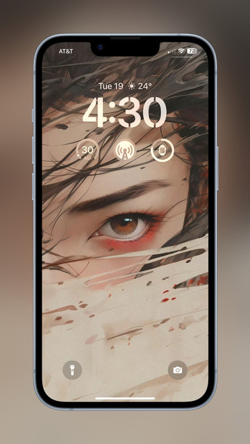 iPhone 12 Pro Max lockscreen screenshot featuring a wallpaper showing a girl’s left eye looking straight