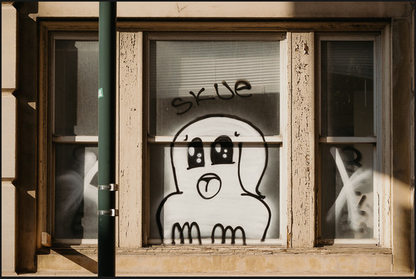 Graffiti of ghost painted on window