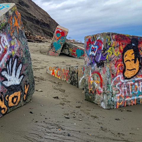 Graffiti on concrete blocks on Cook Inlet Beach in Anchorage