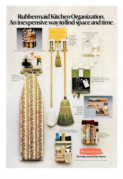 brooms, an Ironing board, and other household cleaning object are seen hanging from the wall.