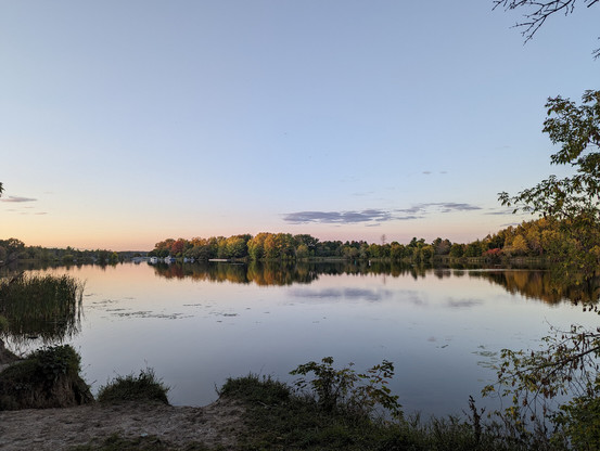 The trees are starting to change color along the Rideau River, near Manotick. A photo at sunset.