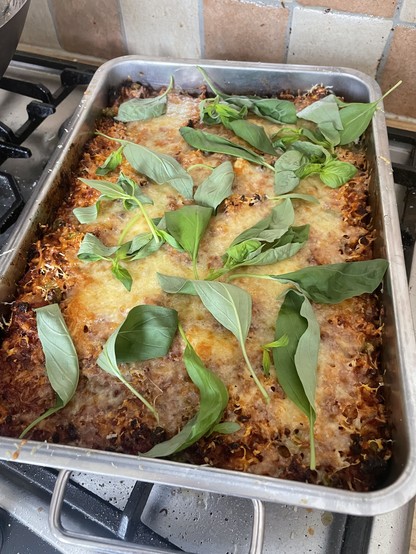 Riso al Forno with fresh basil leaves