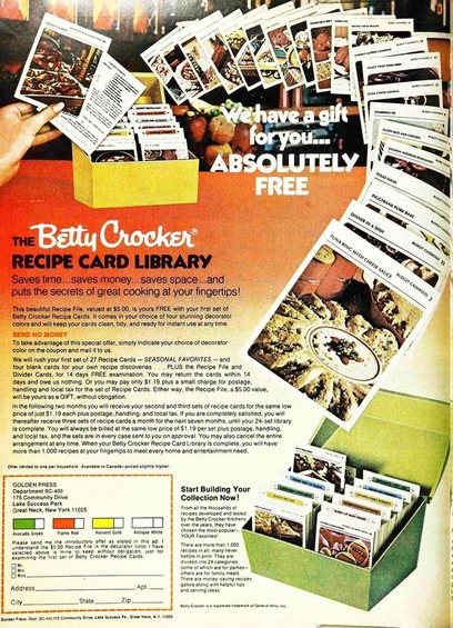 index cards with recipes spill out of a box in this advertisement.
